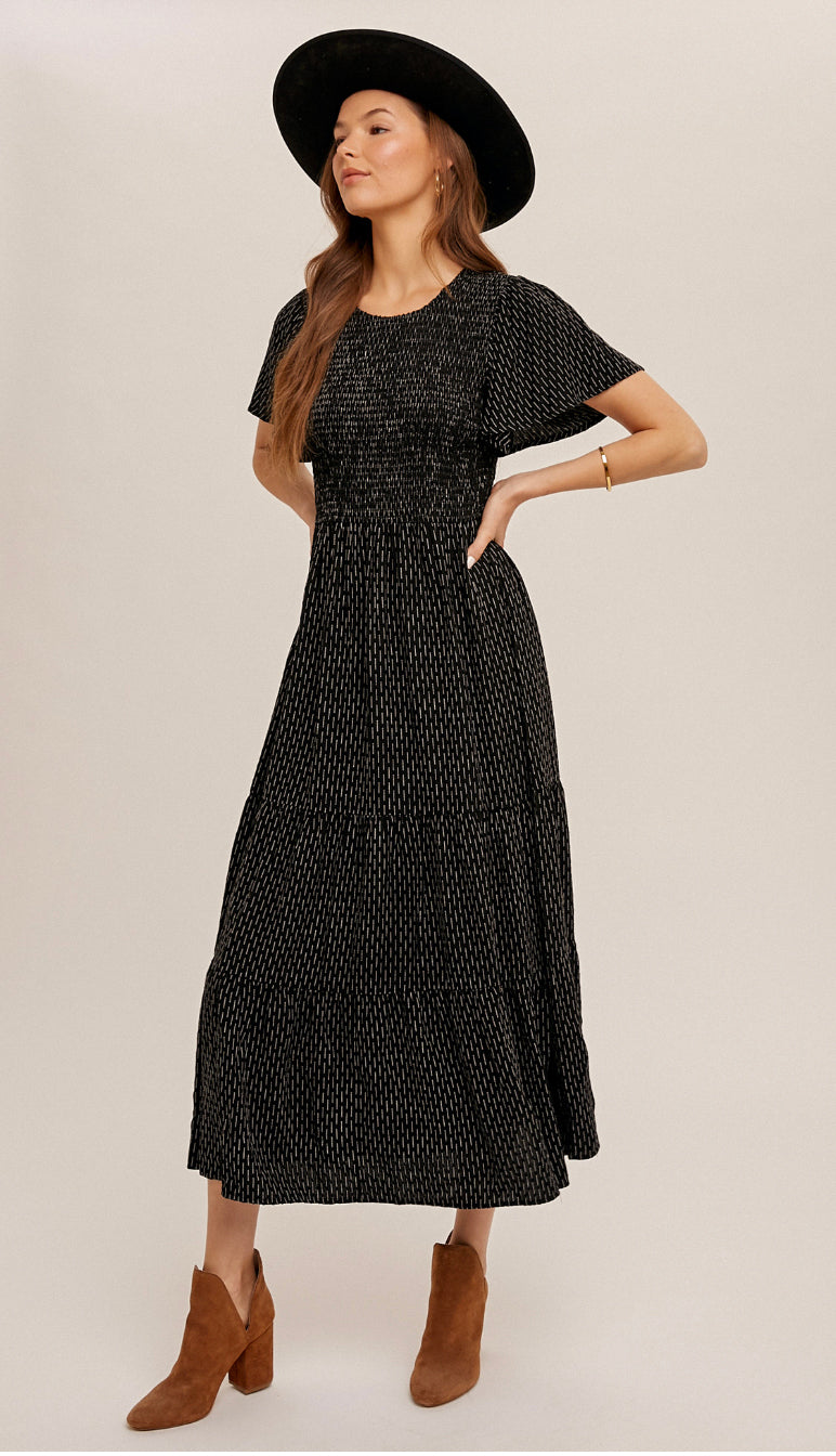 Edie Textured Dot Smocked Midi Dress- Black